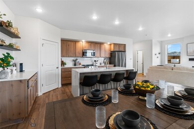 Kitchen featuring dark wood-type flooring, sink, d