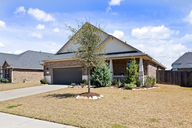 Front exterior of the home adorned with beautiful landscaping.