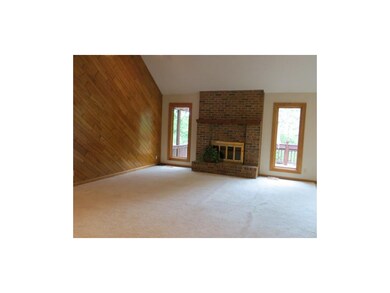 Great Room with dramatic paneled wall, vaulted cei