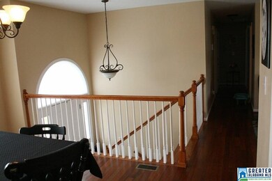 PRETTY ENTRY WITH HARDWOOD STAIRS