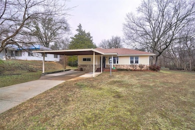 View of front of property featuring a carport and 