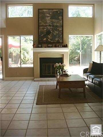 Large living room with high two-story ceilings and