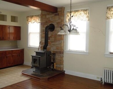 Kitchen. Beautiful stone wood burner in the kitche