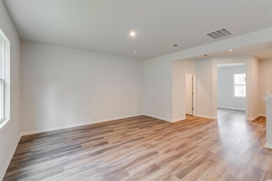 Unfurnished room with light wood-type flooring, visible vents, baseboards, and recessed lighting