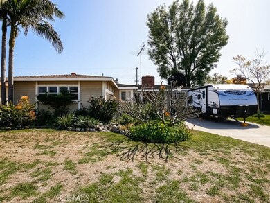 Front of home with landscape.