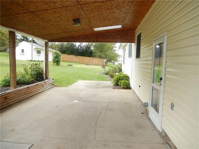 Covered patio could be used as a car port or a gre