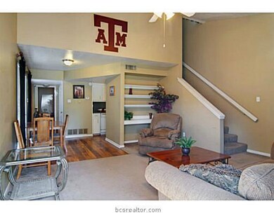 Living Room. The living room is brightened by an a
