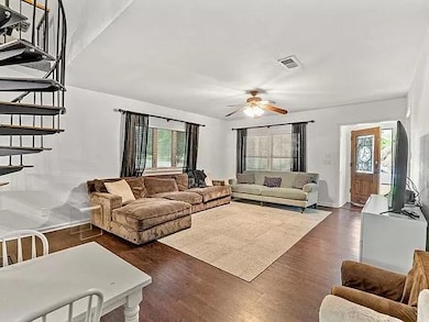 Living area featuring plenty of natural light, ce