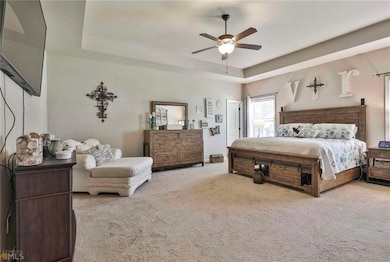 Entryway featuring dark wood-type flooring and baseboards