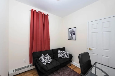 Office area with wood finished floors and baseboards