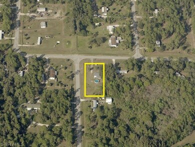 Aerial view of property (outlined in yellow) and surrounding area.