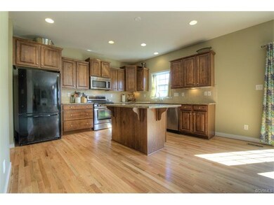 Gourmet kitchen with center island, backsplash, re