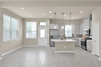 Contemporary kitchen with stainless steel applianc
