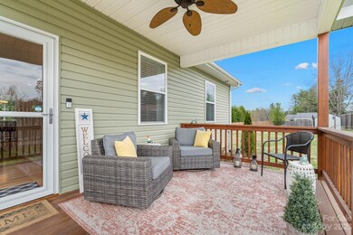 Like a little room of it's own, the covered front porch offers you a warm welcome.