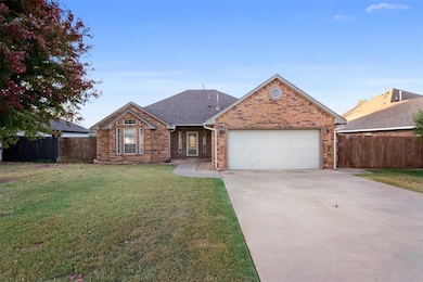 Ranch-style house with a front lawn and a garage