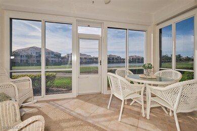 Sunroom / solarium with a water view and a wealth