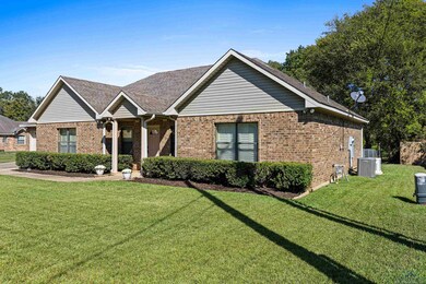 Ranch-style home featuring a front yard and centra