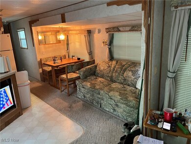 Living area featuring light flooring
