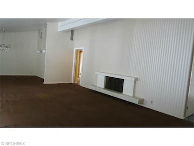 View of fireplace in Living Room.