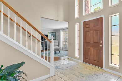 A covered front porch with a solid wood six-panel