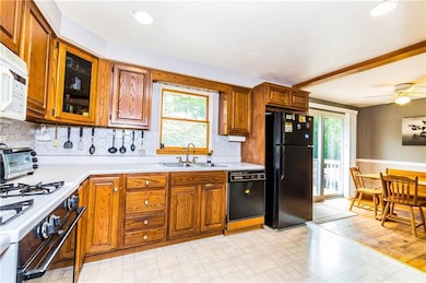 The kitchen is open and airy and boasts recessed l