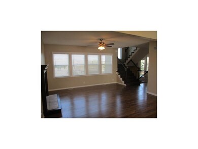 Open floor plan with gas fireplace.