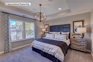 Spacious master bedroom with ample natural light