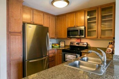 Close up of the kitchen with newer cabinets, grani