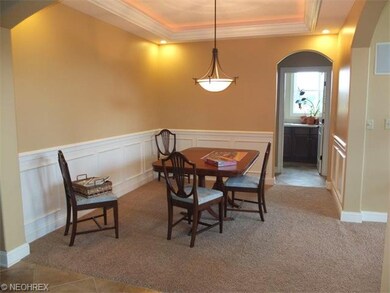 Formal dining room with exceptional lighted tray c