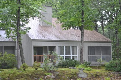 Rear view of condo showing screened...