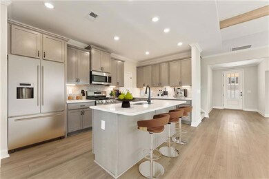 Kitchen with a breakfast bar, a kitchen island wit