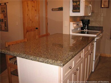 Kitchen. Designer cabinets topped with beautiful g