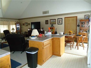 Exterior Front. View of Kitchen Island, Dining Room and Great Room