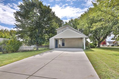 Concrete driveway leads to the 21x20 Carport with 