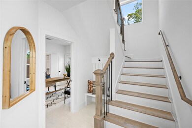 “A welcoming hallway with rich engineered wood flo