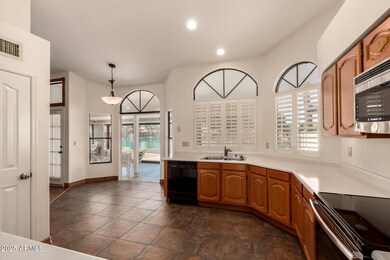 Kitchen overlooks Sunroom