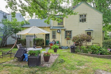 Rear view of house featuring a patio area and a lawn