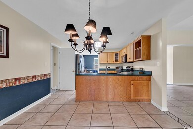 Kitchen with pendant lighting, kitchen peninsula, 