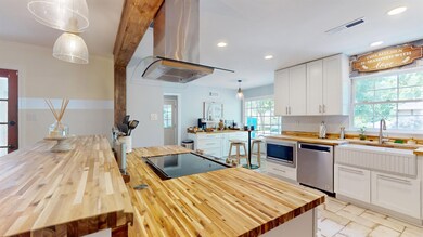 Kitchen featuring stainless steel appliances, pend