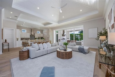 The open concept main living area features a vault
