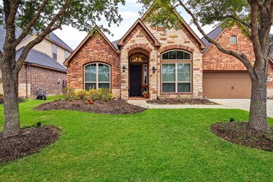 Beautiful stone accents on the front of the home .