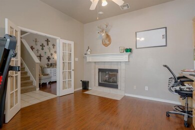 Study with French Doors and built-in cabinets. Dou