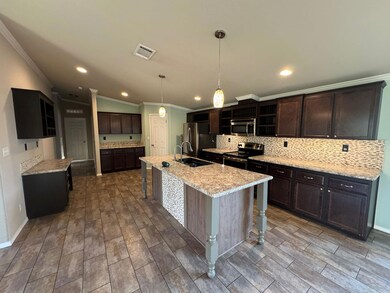 Kitchen featuring appliances with stainless steel