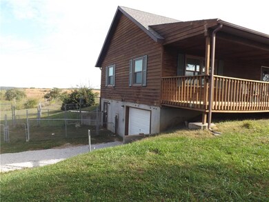 West side of the house showing OH door and walk-ou