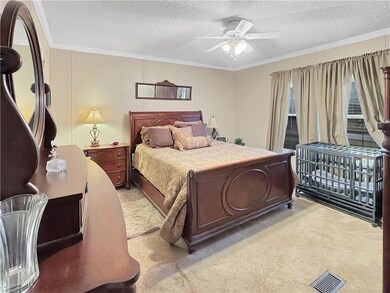 Large primary bedroom with a walk in closet.
