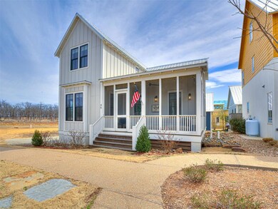 View of front of home with covered porch, board an