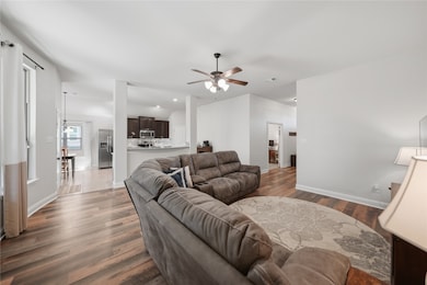 LARGE Living area featuring ceiling fan, wood finished floors, and recessed lighting