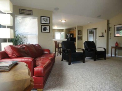 From the time you enter the front door you can see that the neutral decor in the living room can easily accomodate any furniture and decorating style you have.