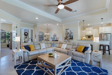 Living room with view into formal dining area and 