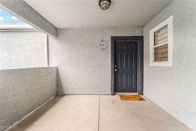 Entrance to property featuring stucco siding